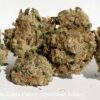Close-up of several dense cannabis buds with crystalline trichomes and orange pistils, labeled as Liberty Haze by Costa Canna (Cowichan Tribes).