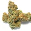Von Barneys Farm Seeds Peyote Cookies.Close-up of a cannabis bud displaying a dense structure with a mix of green and orange hues and crystalline trichomes.
